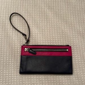 Pink and navy blue coach wristlet